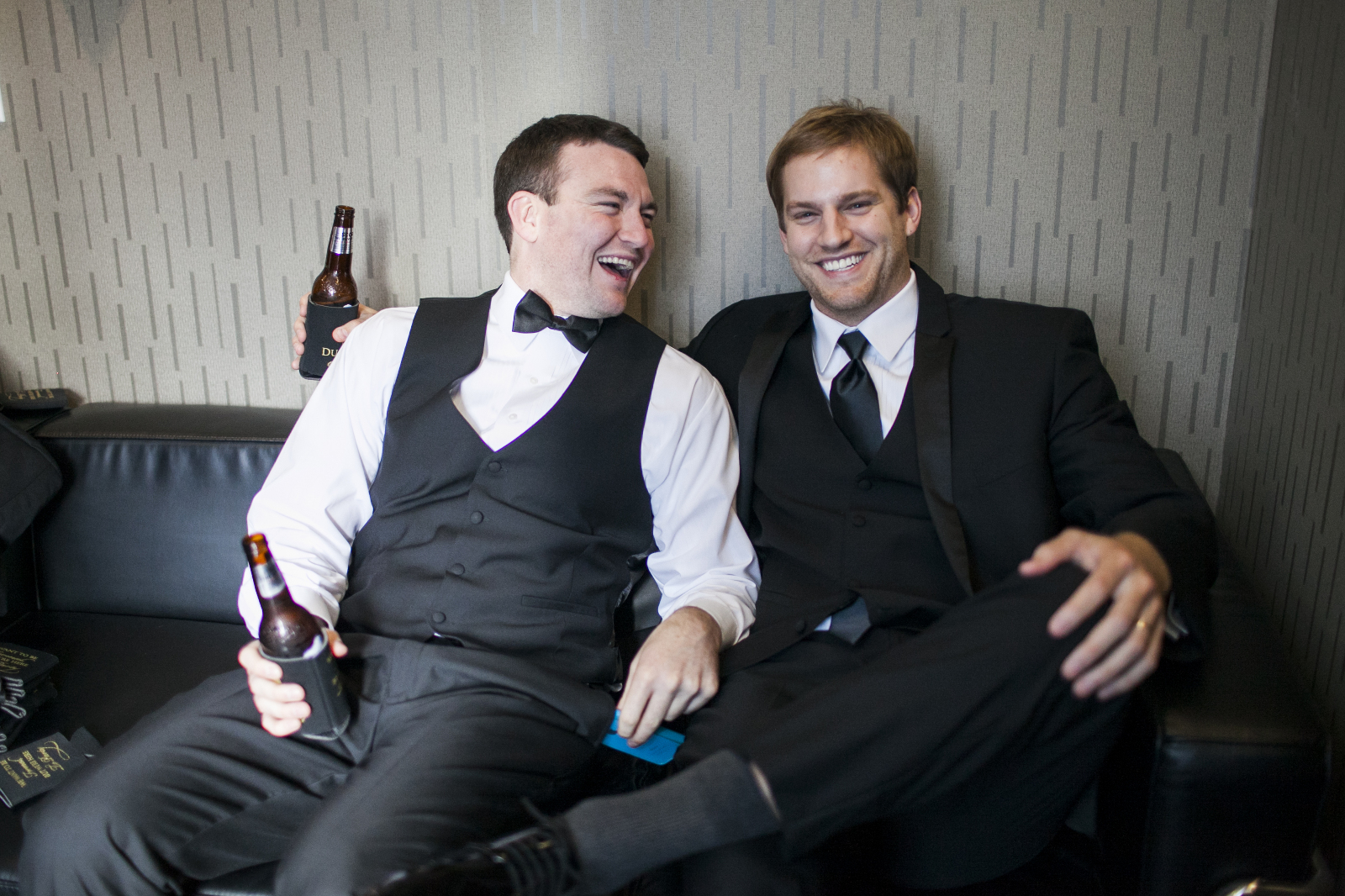 groom and groomsmen wait in the greenroom for the wedding ceremony at the bridge building in nashville