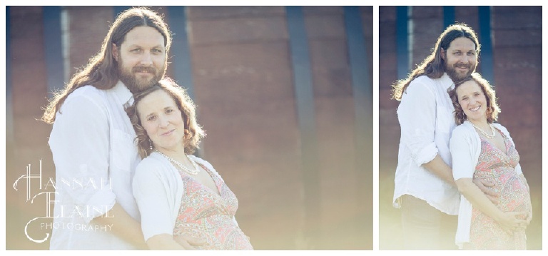 sun flare on a couple smiling for maternity photos