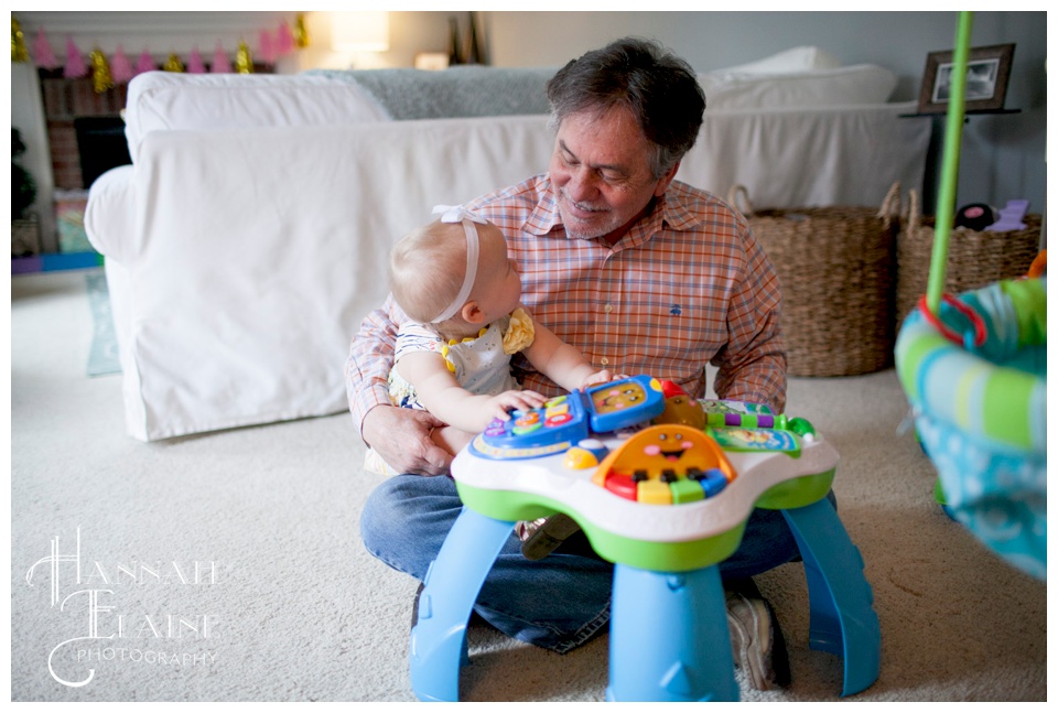 baby plays with her grandfather in franklin