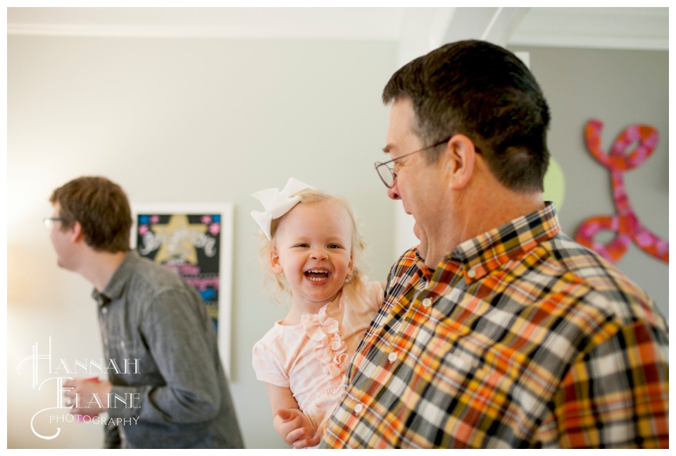 grandpa makes his granddaughter laugh