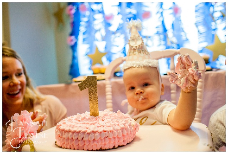 one year old covered in icing from first birthday cake smash
