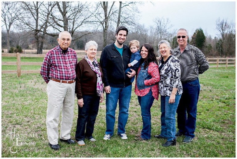 four generations stand together for family photo on a farm