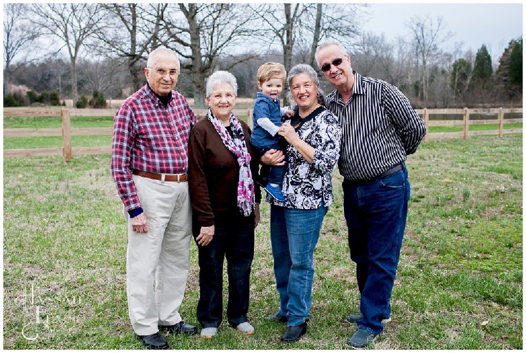 grandparents and spanish great grandparents stand for family portrait with grandson