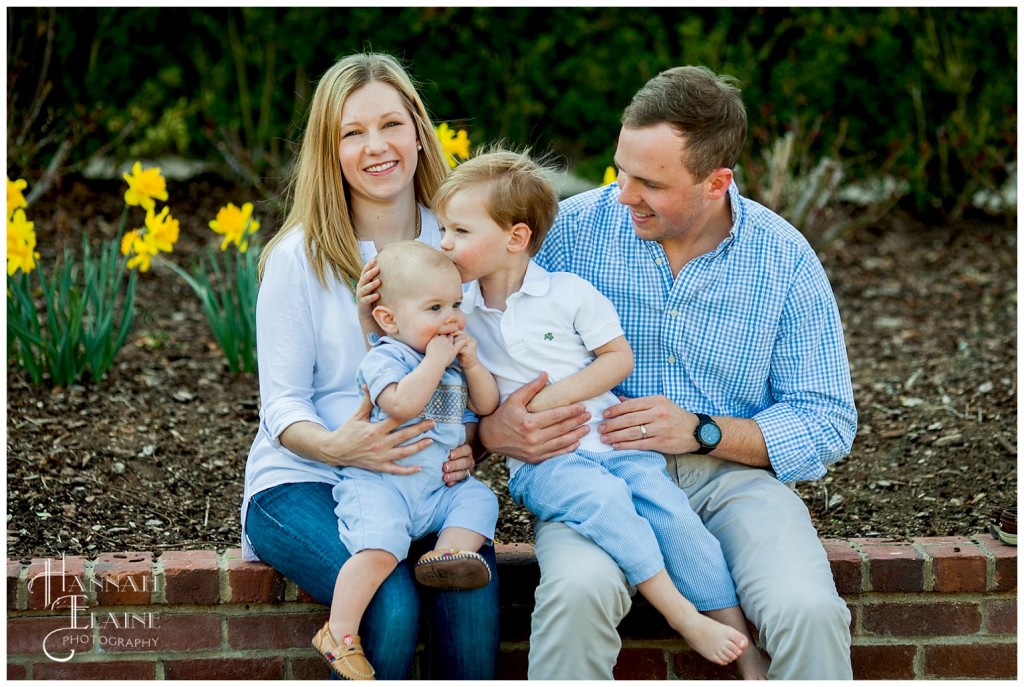 brothers embrace during a family portrait session on the westhaven great lawn