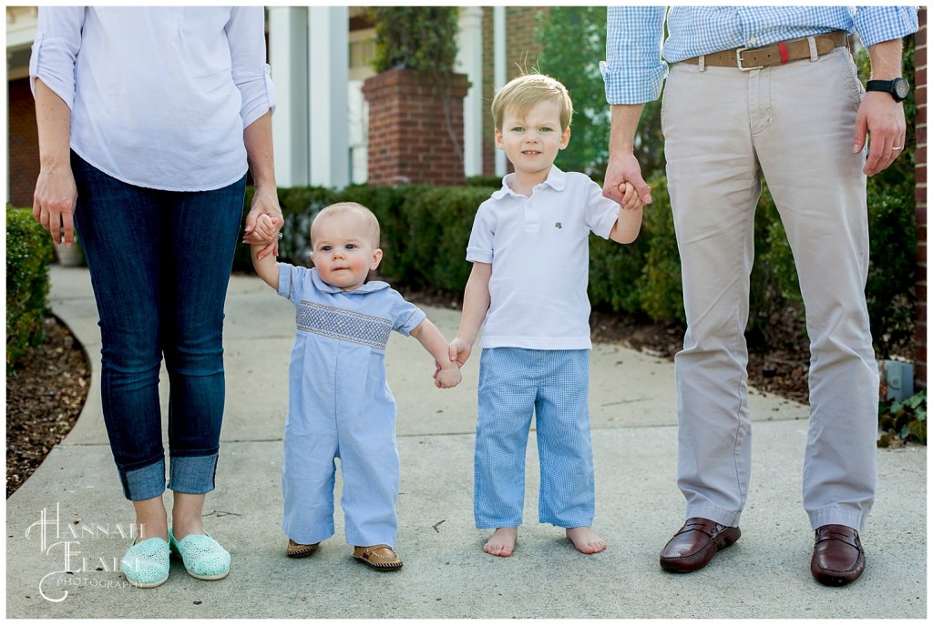 a family holds hands