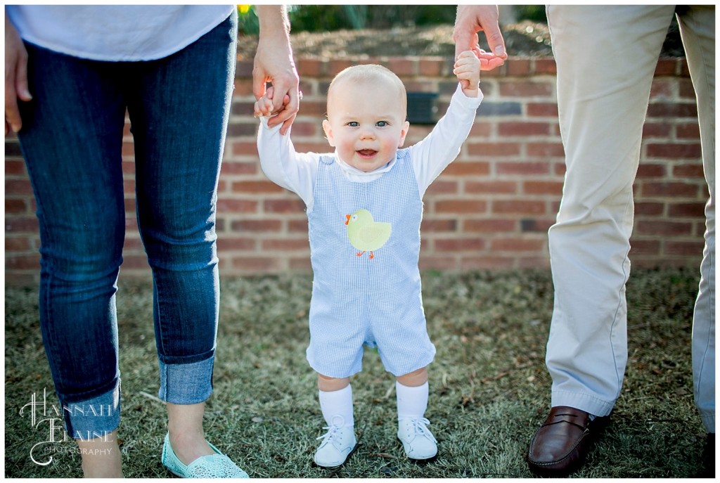 henry stands between mom and dad