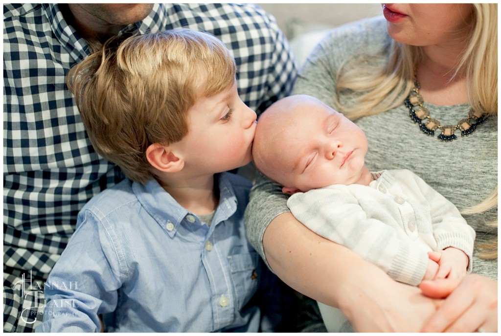 ashton kisses baby brother anders on the head