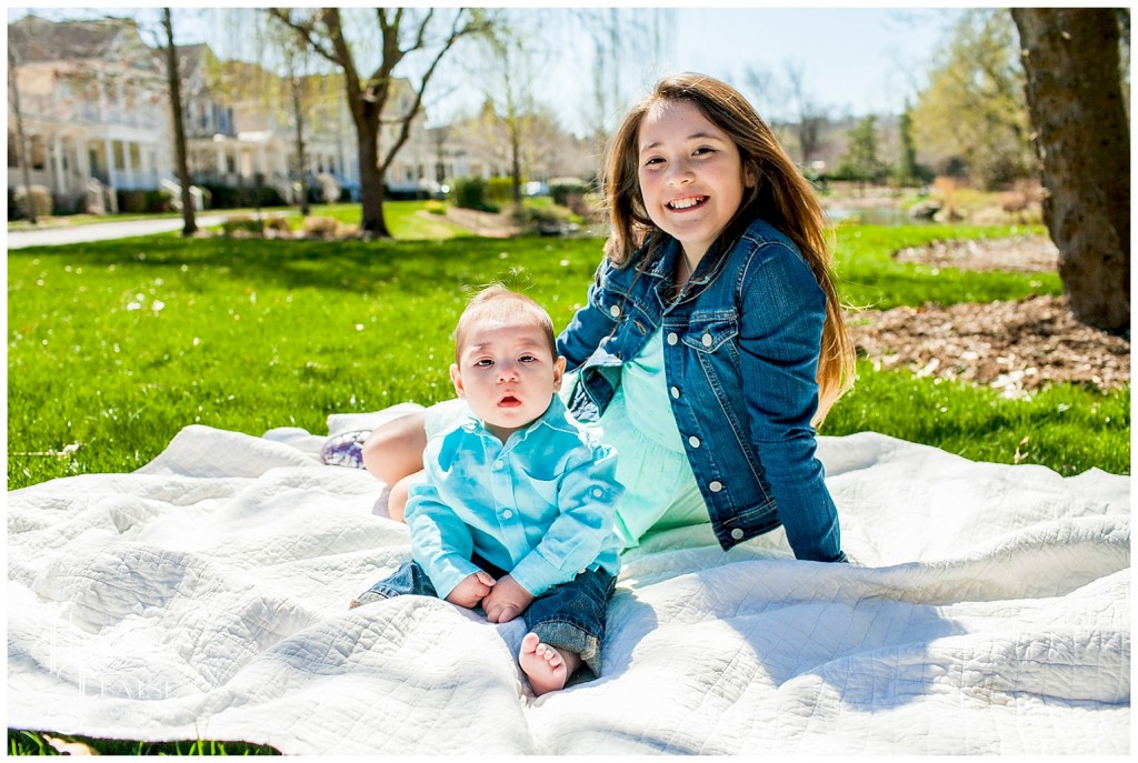 brother and sister hanging out in the park