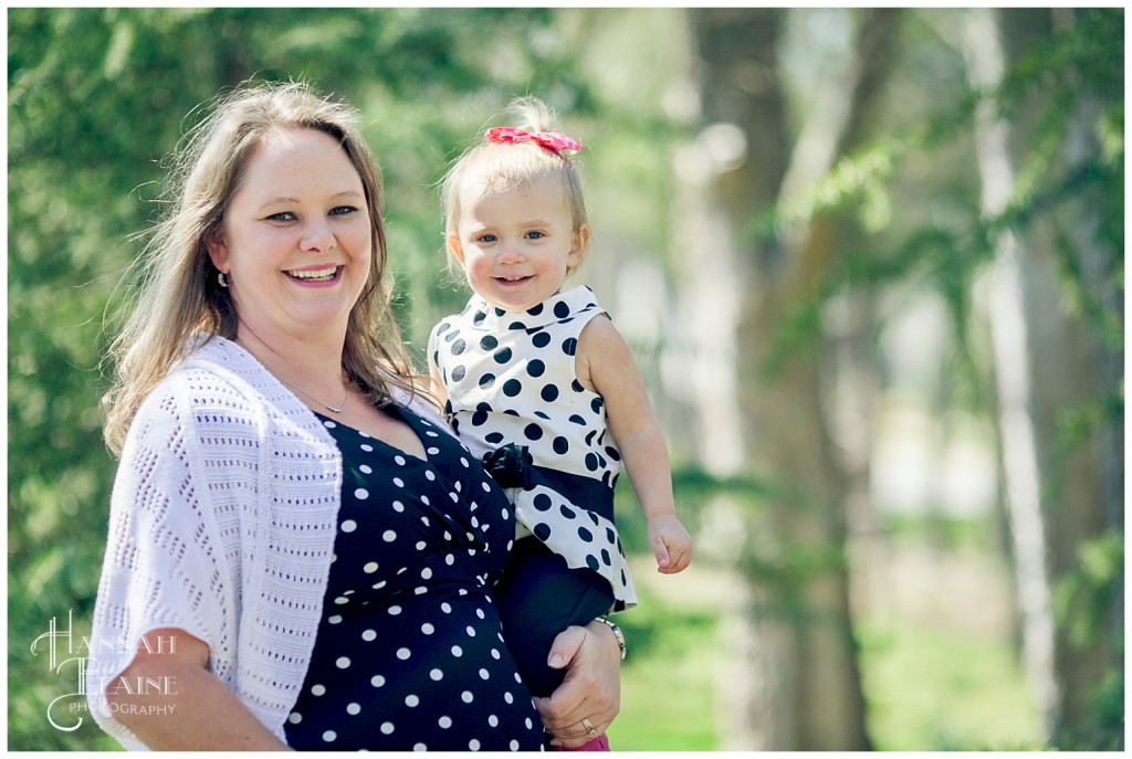 katie holds her daughter for a portrait