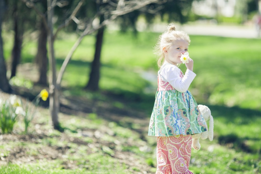 little girl plays by the creek in pearl street park