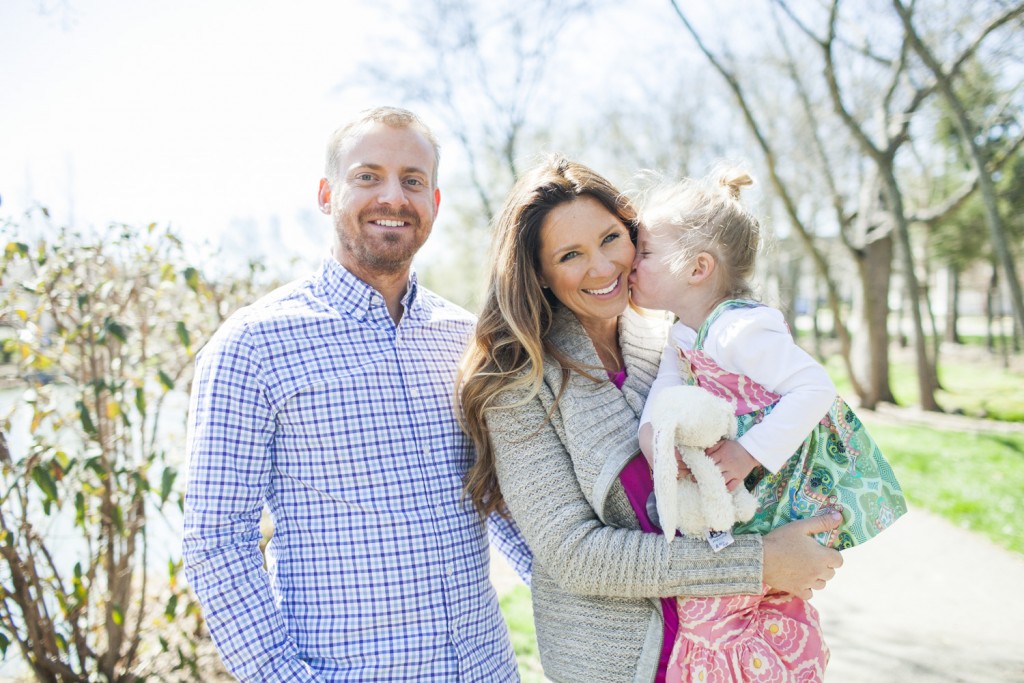 little girl kisses mommy during family portraits