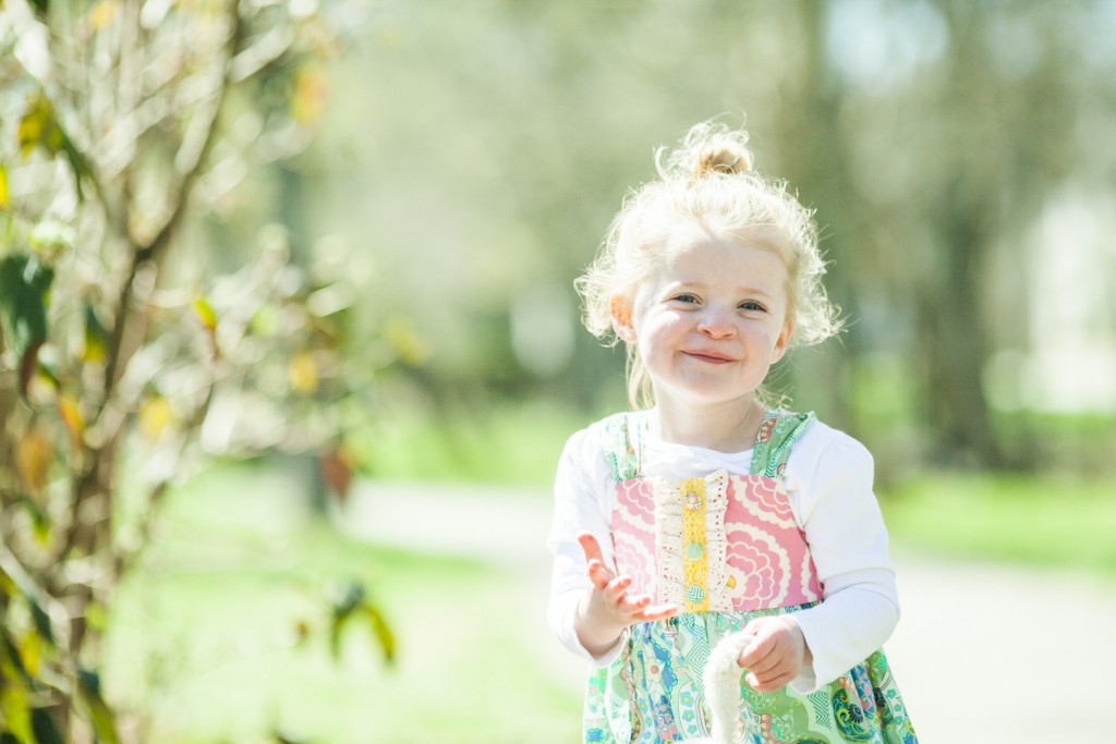 pretty girl plays in pearl street park