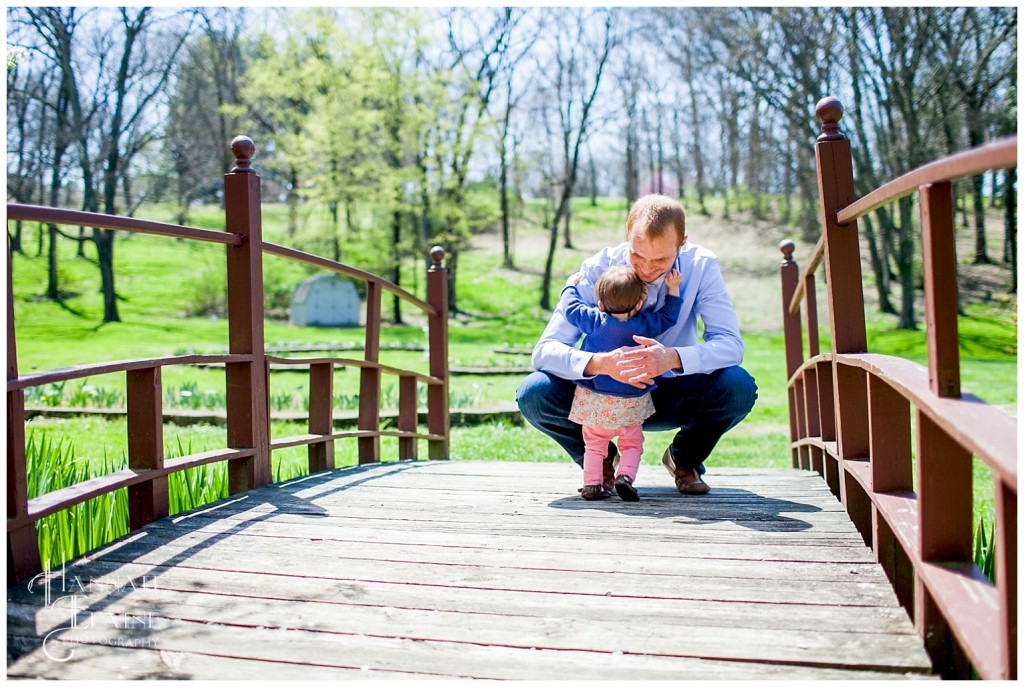 juliet runs to daddy for a hug at the park