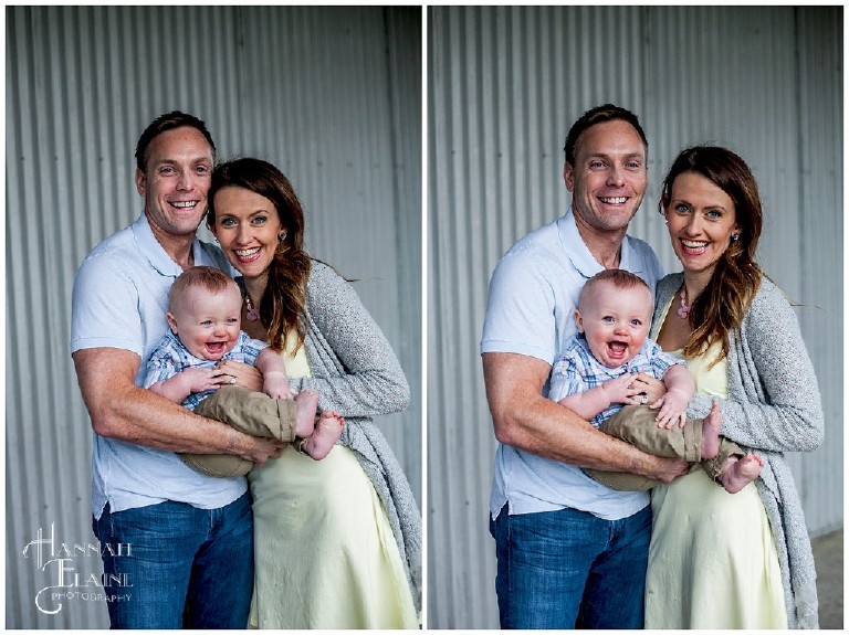 rustic corrugated metal wall serves as background for smiling family
