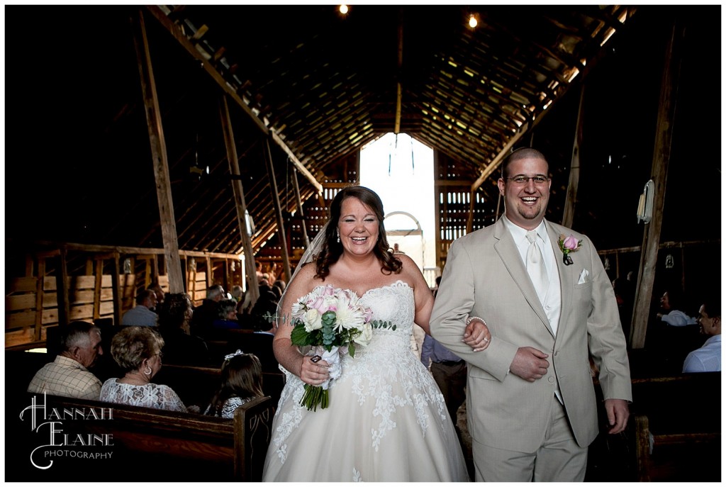 a man and wife walk back down the aisle during the recession