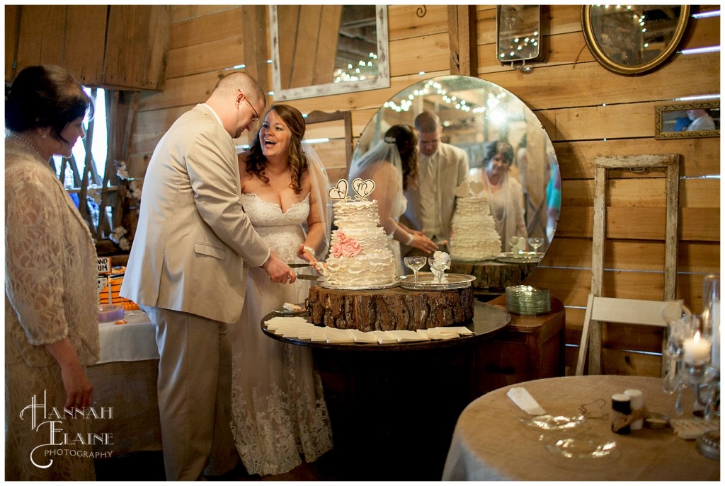 rustic barn wedding cake cutting ceremony