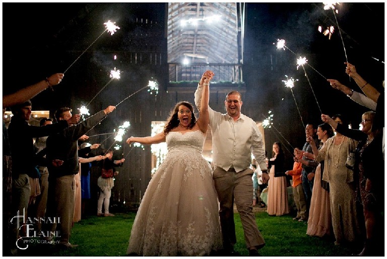 a couple leaves their reception in a sparkler exit