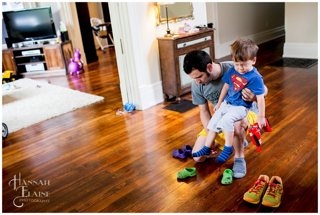 dad helps andres with his shoes in the middle of a sneeze