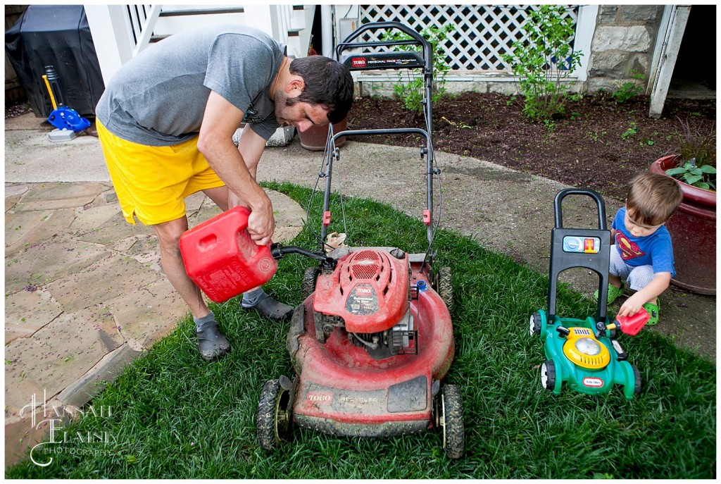 dad fills lawnmower with gas and son imitates with his toy lawnmower