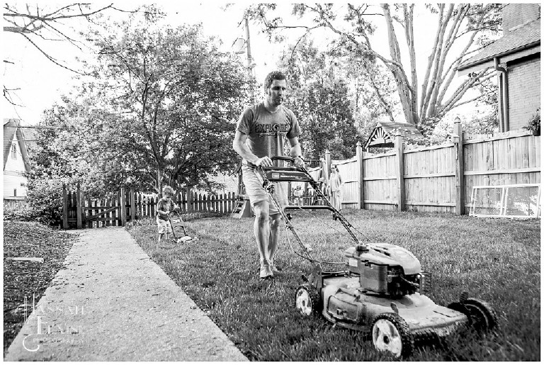 andres follows behind dad with his toy mower as dad mows the lawn