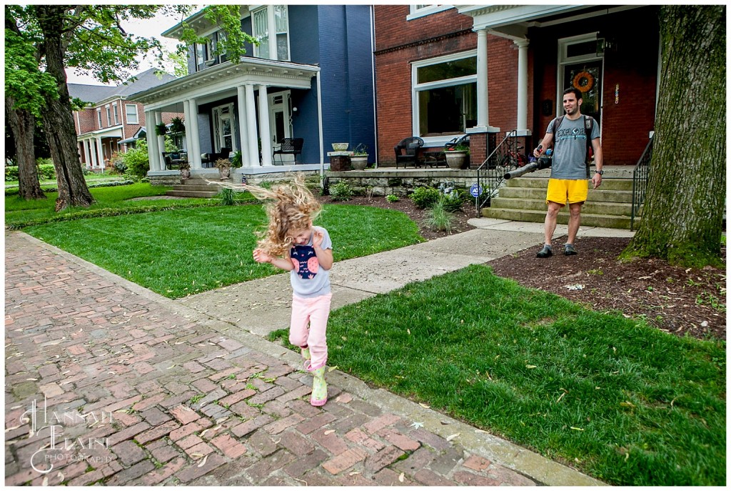 dad points leaf blower at his daughter's hair