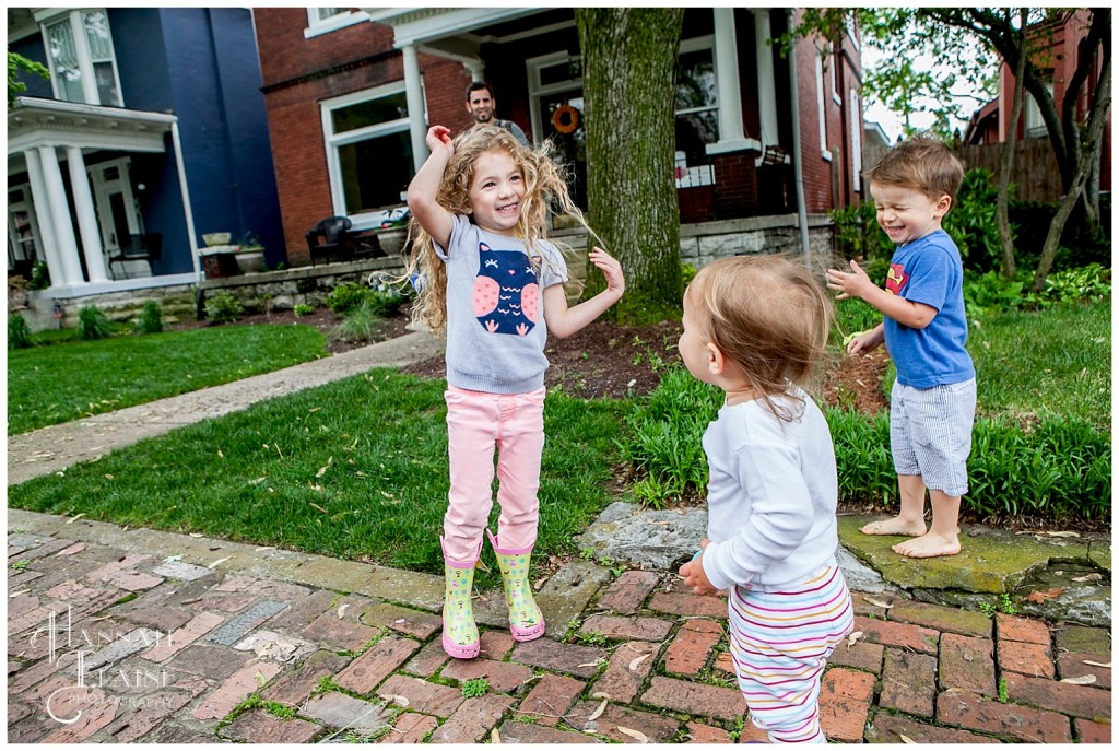 dad sprays the kids with leaf blower