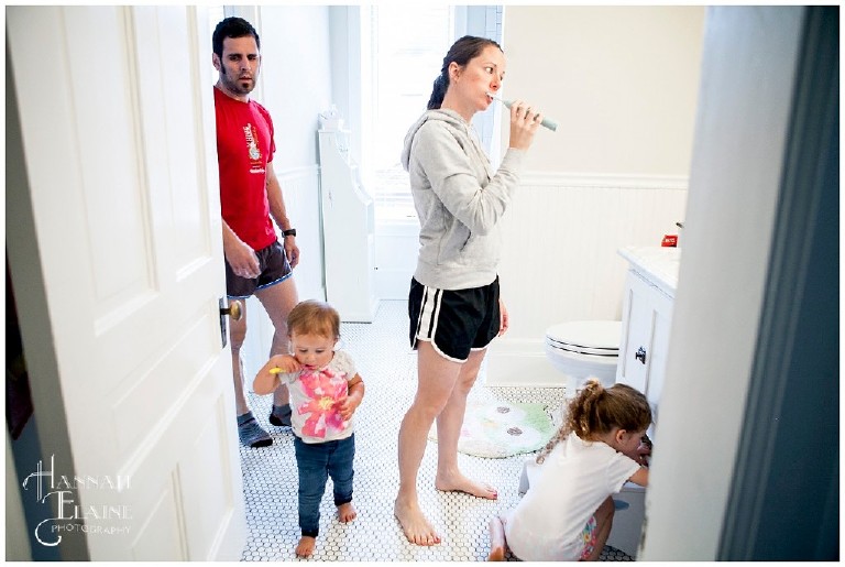 family gets ready for the day in the bathroom