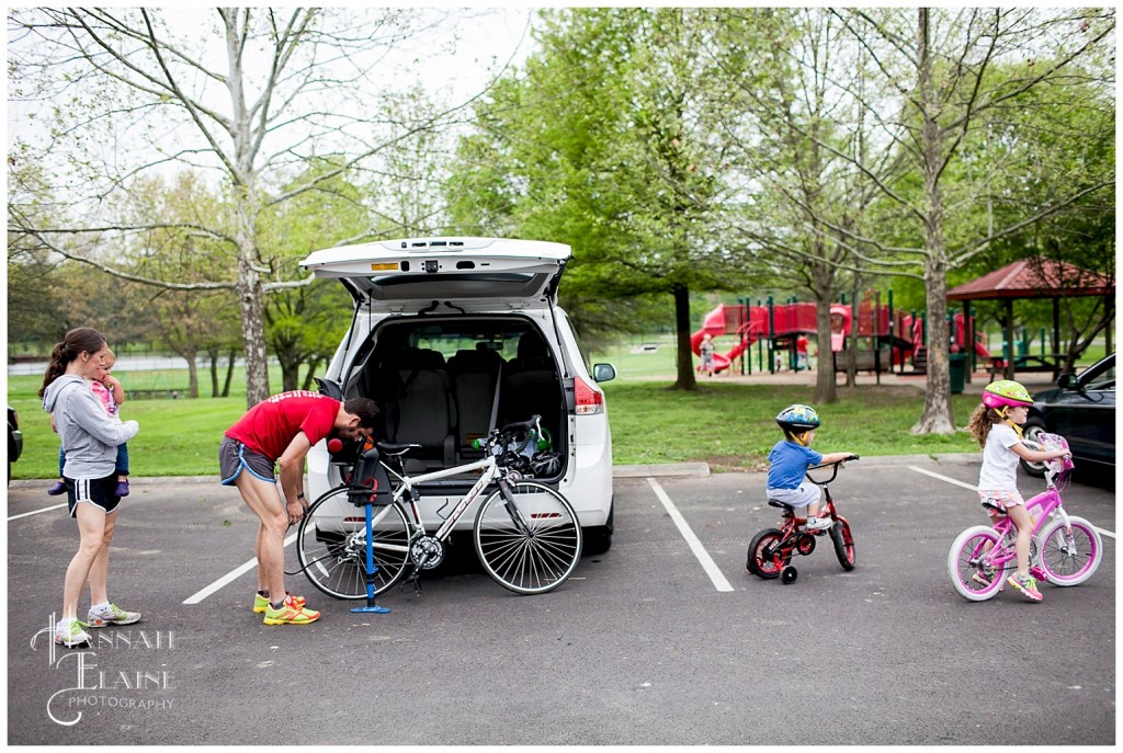 pumping up tires for the family bike ride in shelby park