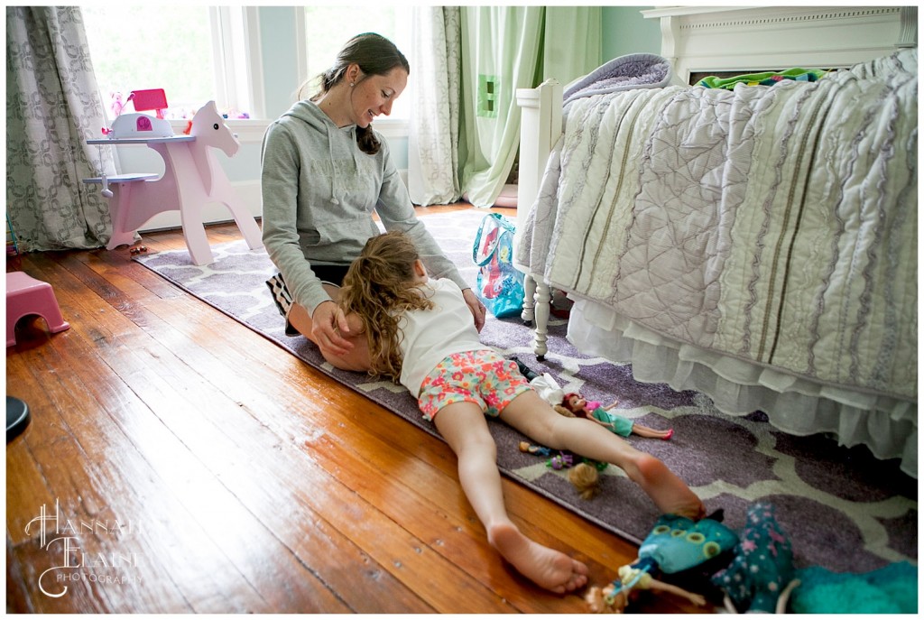 girl is tuckered out on her bedroom floor