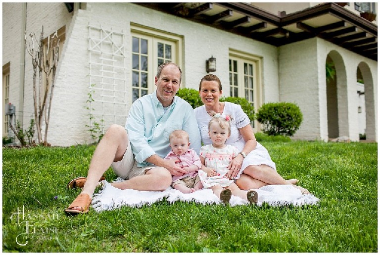 a family sits for a portrait in front of their brentwood home