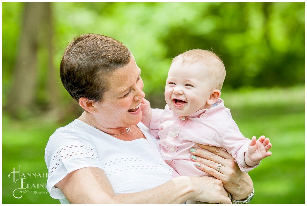 mom holds her laughing baby boy