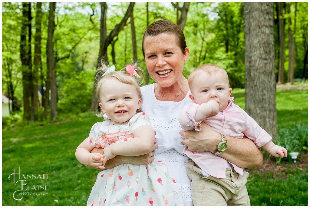 mom makes the kids laugh in both arms