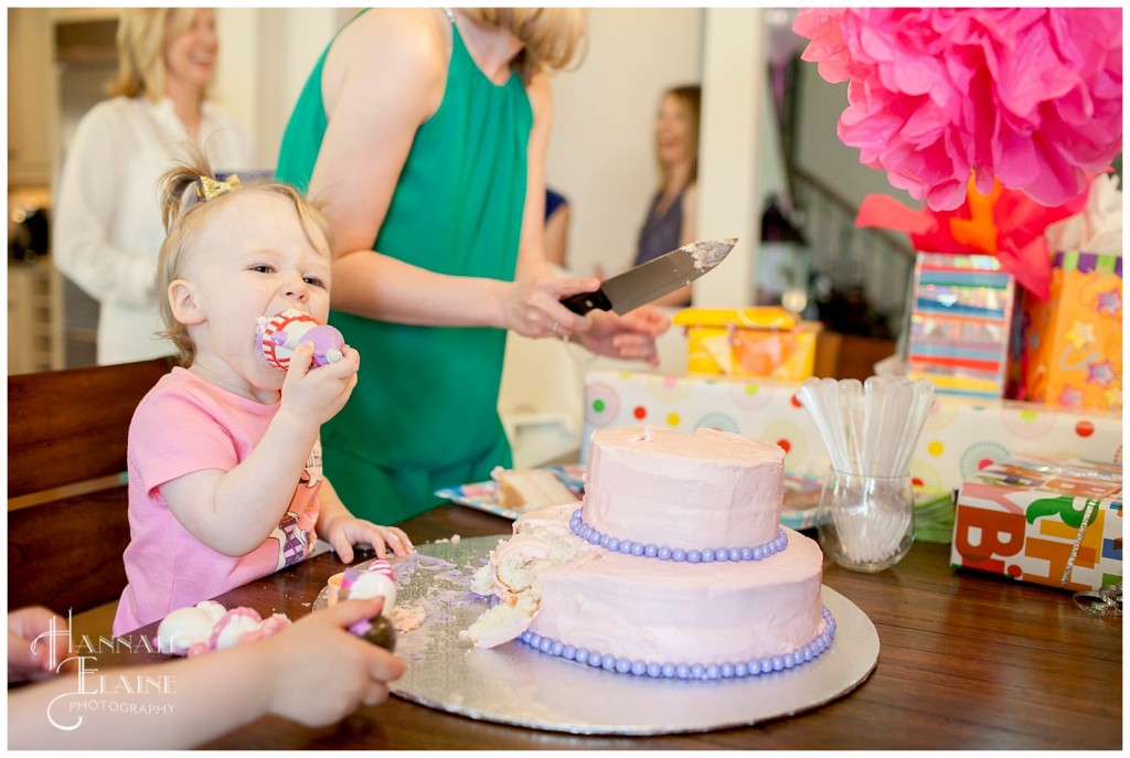 della enjoys licking the icing off of lamby on her doc mcstuffins birthday cake