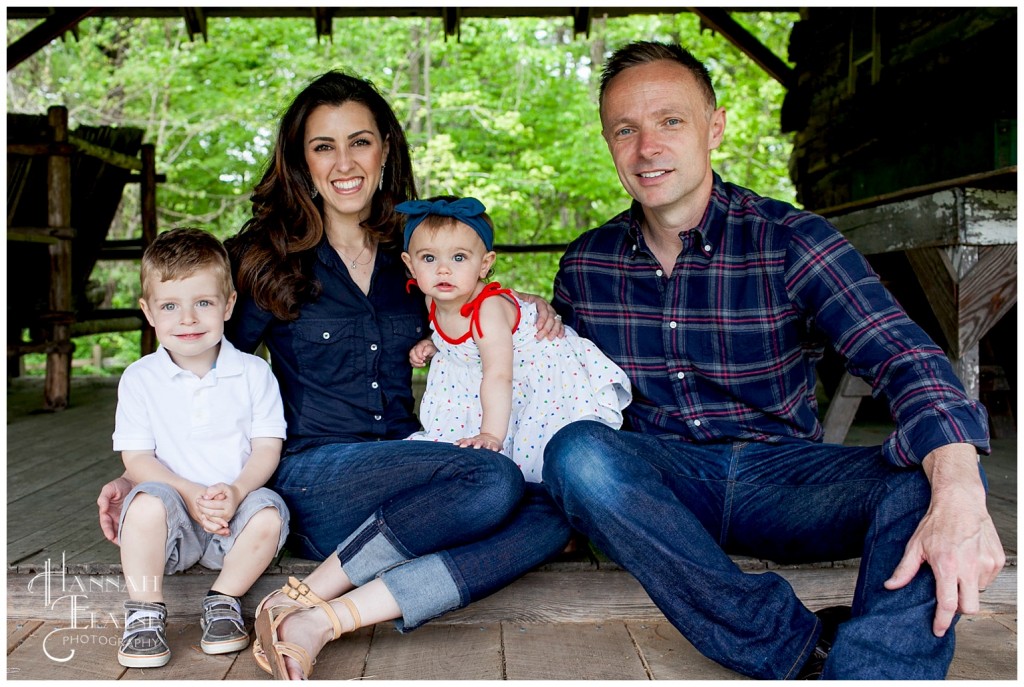 family takes spring photos at the cabins