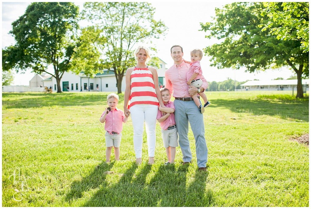 golden sunlight backs the family in the field