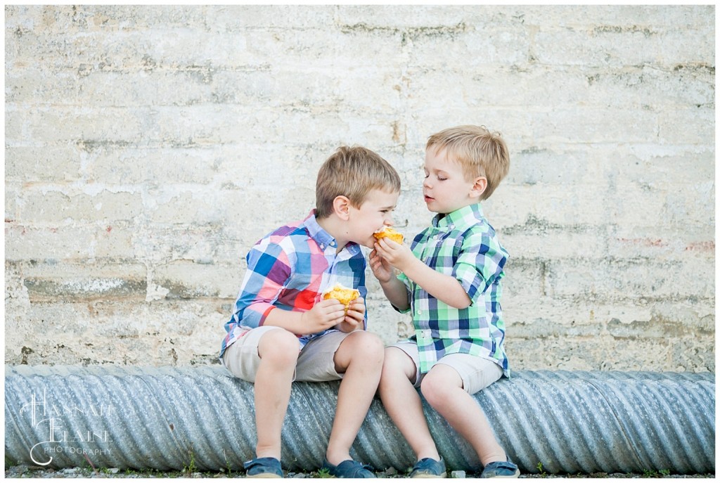 boys let each other taste their whole foods cupcakes