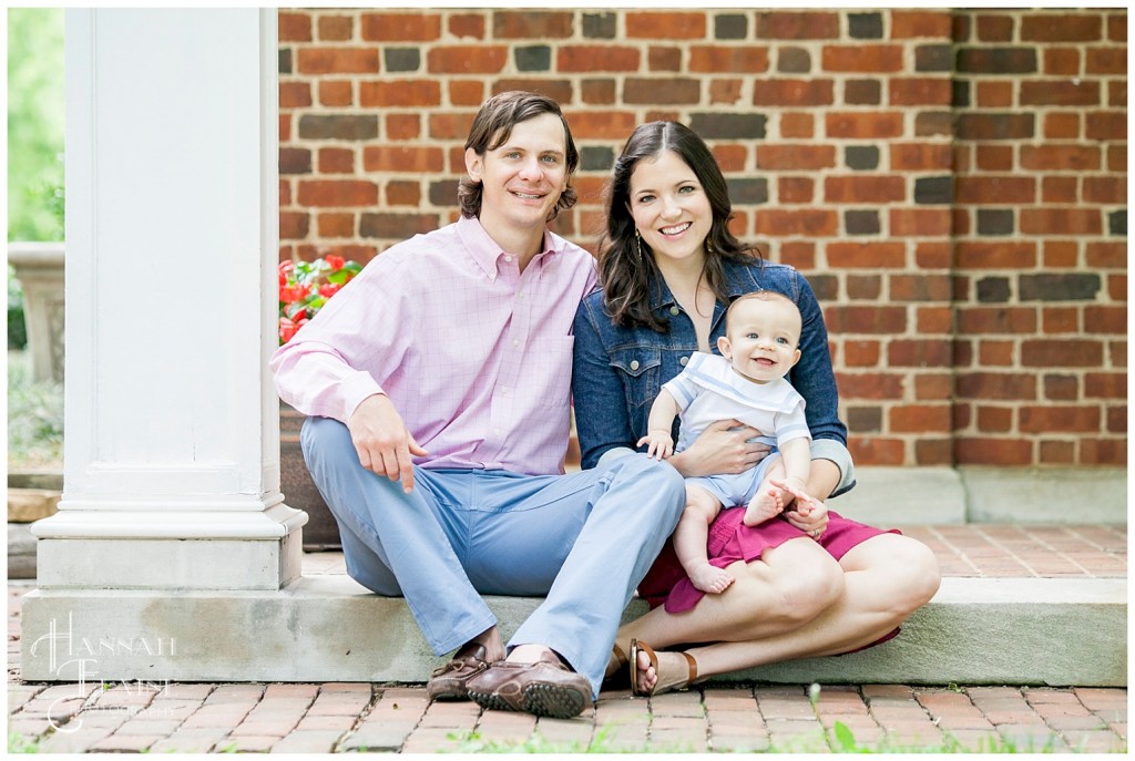 mom and dad take a photo with their 7 month old son