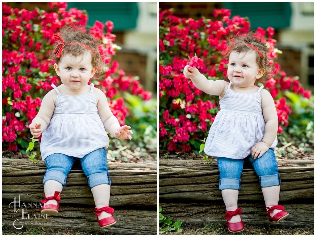 little girl sits on railroad tie in front of azaleas