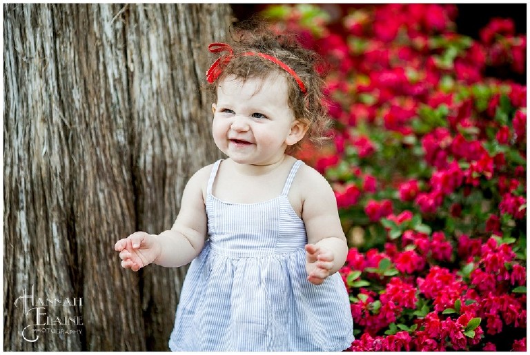 little girl giggles in the garden