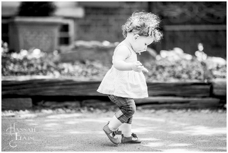 black and white image of little girl walking