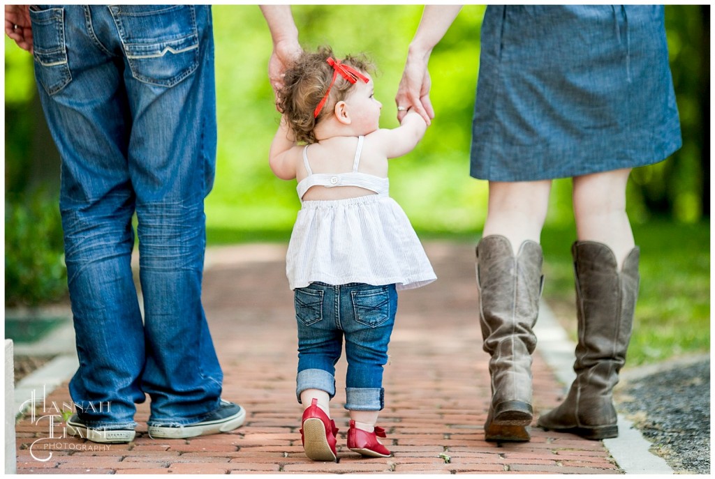 family walking down a brick path