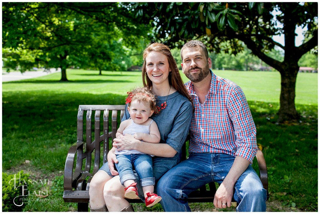 pretty family on a park bench