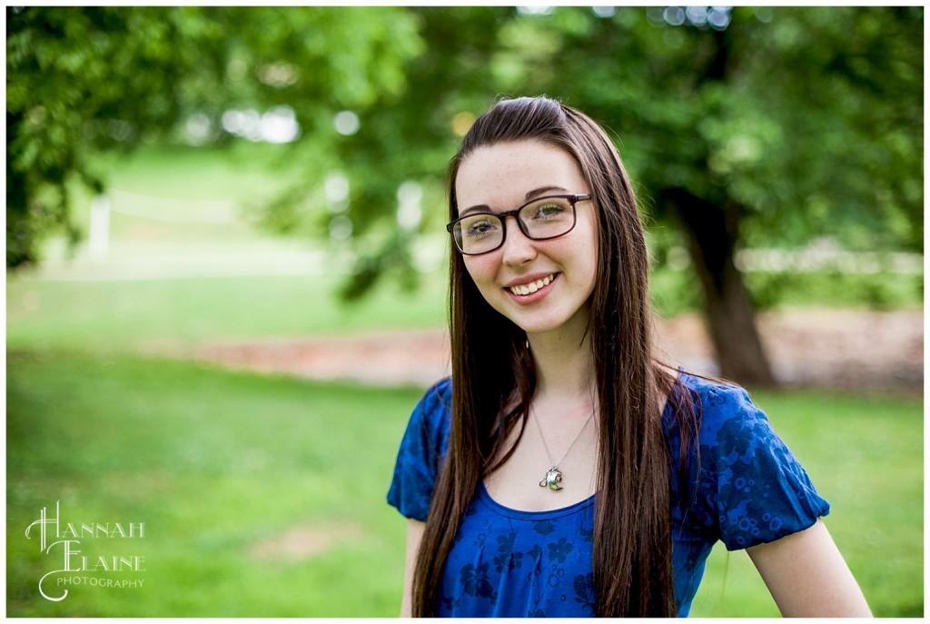 teenage girl smiles in the park