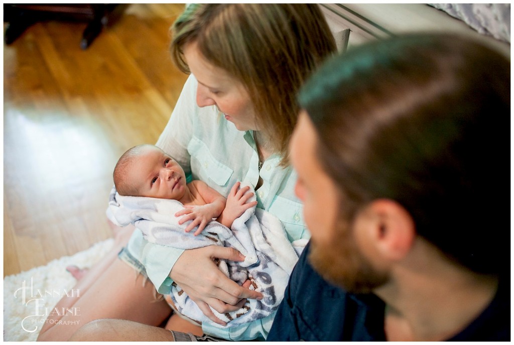 shot of mom holding baby from above