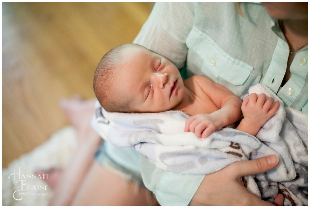 little baby sleeping in mommy's arms