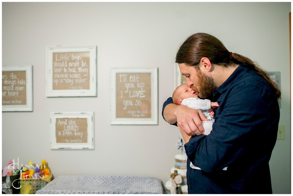 new daddy kisses baby boy