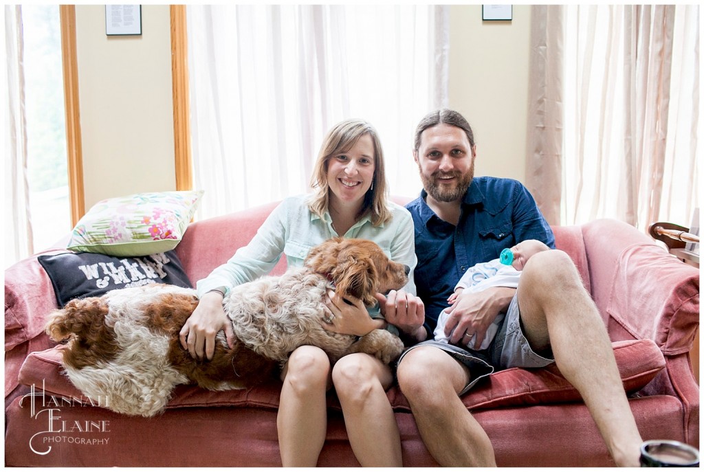 family portrait with the newborn and the puppy