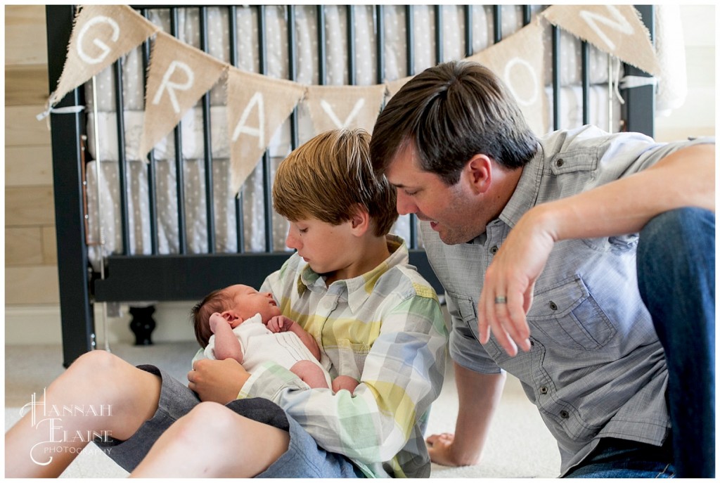 big brother and dad spend time with new baby brother