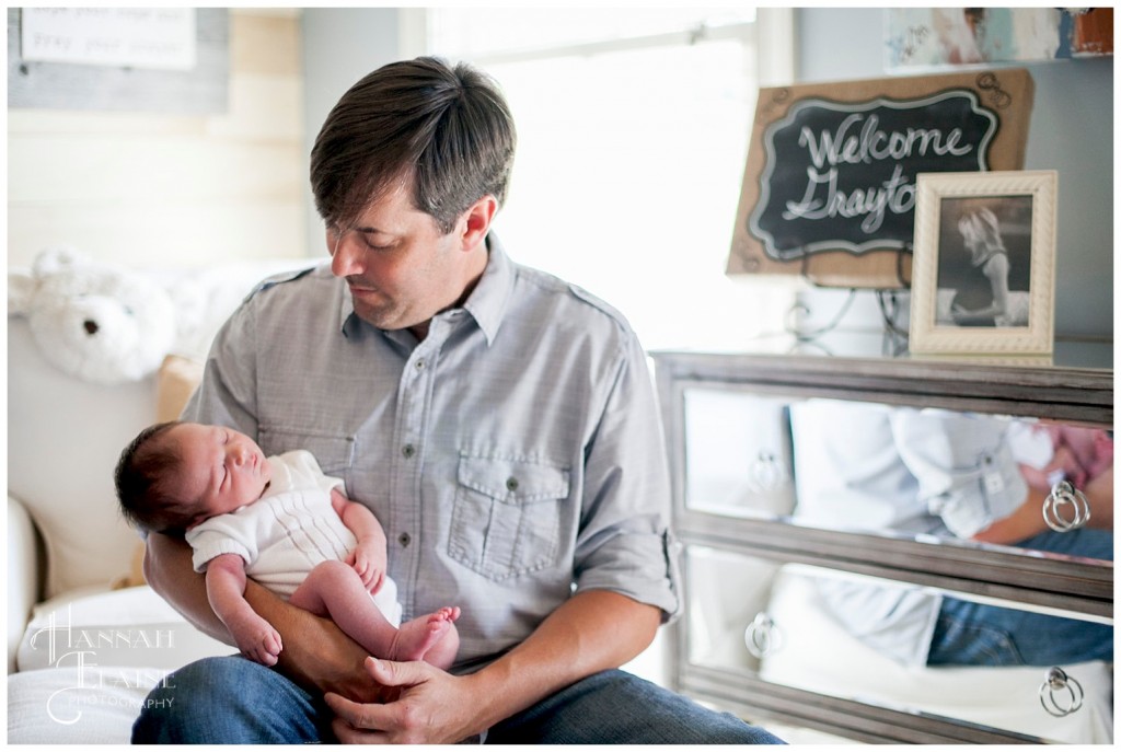 dad and son hang out in the nursery