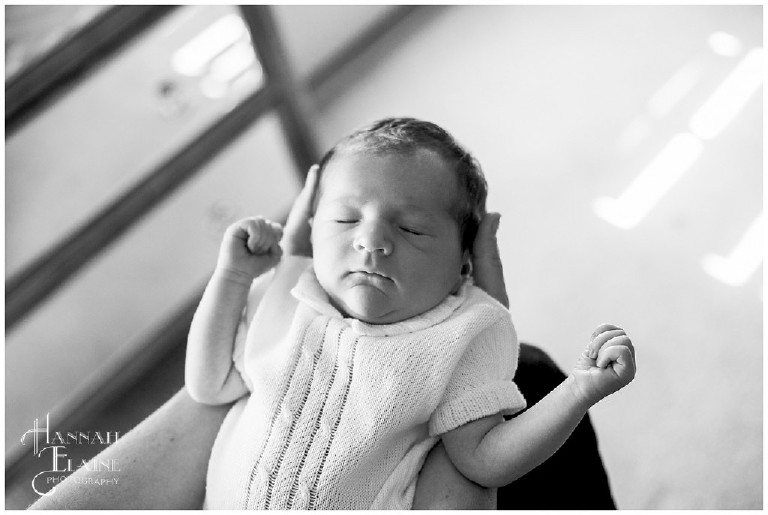 black and white newborn photo in momma's lap